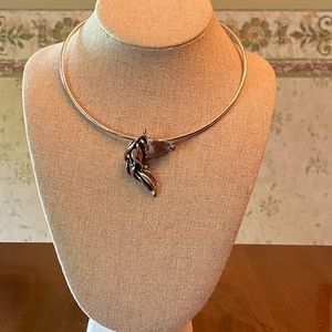 Silver slide horse necklace.